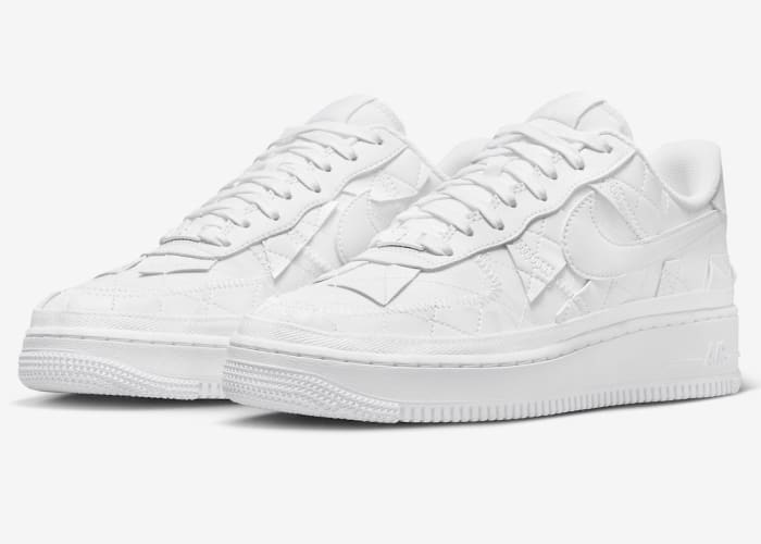 View of white Nike Air Force 1 shoes.